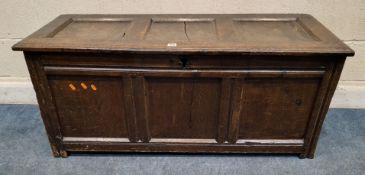 A GEORGIAN OAK COFFER, the hinged lid engraved H T, width 123cm x depth 48cm x height 54cm,