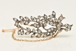 AN LATE 19TH TO EARLY 20TH CENTURY DIAMOND SET FOLIATE BROOCH, milgrain collet set with old cut
