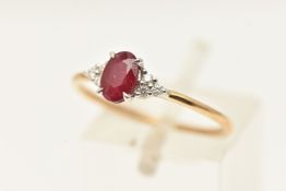 A 9CT GOLD GEM SET RING, an oval cut ruby flanked with six round brilliant cut diamonds, prong set