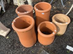 FIVE CHIMNEY POTS, including four terracotta pots, two being a pair, 46cm high