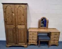 A DUCAL PINE FOUR PIECE BEDROOM SUITE, comprising a double door wardrobe, width 100cm x depth 60cm x