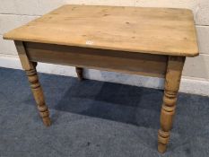 A 19TH CENTURY PINE FARMHOUSE STYLE KITCHEN TABLE, with a single frieze drawer, raised on block