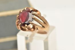 A 9CT YELLOW GOLD GARNET SINGLE STONE RING, set with an oval shaped mixed cut garnet, claw set