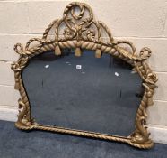 A GOLD PAINTED VICTORIAN OVER-MANTEL MIRROR, with rope effect details, two mythical creatures, width