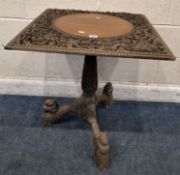 AN EARLY 20TH CENTURY BURMESE CARVED OCCASIONAL TABLE, with a central circular surface, pierced