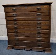 AN ART NOUVEAU OAK CHEST OF NINE DRAWERS, with brass handles, raised on bracket feet, width 131cm