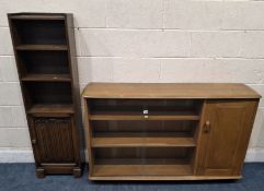 A PRIORY OAK BOOKCASE, the double glass sliding doors enclosing two adjustable shelves, a single