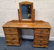 A MODERN PINE DRESSING TABLE, with two banks of four drawers, width 132cm x depth 45cm x height