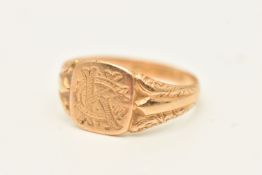 AN EARLY 20TH CENTURY 18CT GOLD SIGNET RING, of a square form with engraved monogram, textured