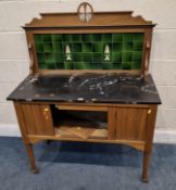 AN EARLY 20TH CENTURY MARBLE TOP WASH STAND, with a raised tile back, atop a base with a single