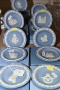 A GROUP OF THIRTEEN WEDGWOOD JASPERWARE PIN DISHES in blue and white, some featuring military