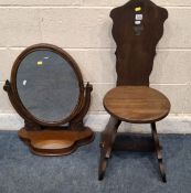 AN EARLY 20TH CENTURY SPINNING CHAIR, the back rest with a trefoil design, raised on trestle style