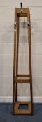 A LATE 20TH CENTURY COAT / HAT STAND, with eight assorted hooks, 38cm squared x height 190cm,