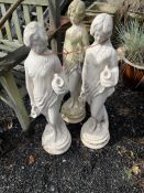 A SET OF THREE CONCRETE GARDEN FIGURES, in the form of female water carriers, 81cm high