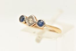 A YELLOW METAL BLUE SAPPHIRE AND DIAMOND RING, illusion set single cut diamond centre, flanked