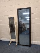 A LARGE RECTANGULAR MIRROR, 180cm x 61cm, along with a cheval mirror, condition report: marks,