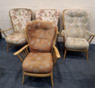 LUCIAN ERCOLANI, FOUR ERCOL MID-CENTURY ELM AND BEECH ARMCHAIRS, ranging in sizes, upholstery,