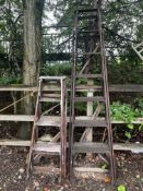 TWO HATHERLEY WOODEN STEP LADDERS, both with lattice sides, the tallest being 230cm high (2)