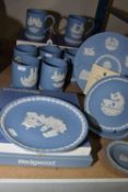 A COLLECTION OF WEDGEWOOD JASPERWARE, featured in blue and white, to include plates, trinket plates,