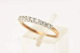 A 9CT GOLD DIAMOND SET BAND RING, nine round brilliant cut diamonds prong set in white gold,