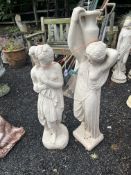 TWO LARGE CONCRETE GARDEN FIGURES, both in the form of female figures, one carrying a ewer aloft,