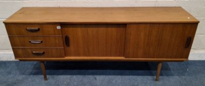 A MID-CENTURY TEAK SIDEBOARD, fitted with three drawers and double sliding doors, raised on