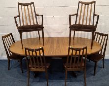 G PLAN, A MID-CENTURY TEAK OVAL EXTENDING DINING TABLE, with a single fold-out leaf, extended length
