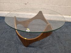 POSSIBLY HENRY P GLASS, A MID-CENTURY BIOMORPHIC COFFEE TABLE, with a circular glass top, diameter
