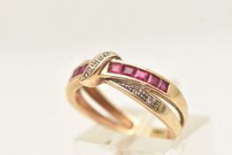 A 9CT YELLOW GOLD GEM SET RING, a cross over band ring, set with rubies and diamonds, hallmarked 9ct