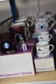TEN COMMEMORATIVE WEDGWOOD MUGS, comprising two hand-made tankards in amethyst and clear glass,