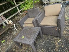 A PAIR OF RATTAN EFFECT GARDEN CHAIRS, with cushions, and an occasional table (3)