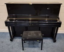 A 2004 GLOSSY BACK YAMAHA U1 PIANO, serial number 6066313, the hinged lid with locking pegs for a