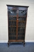 AN EARLY 20TH CENTURY MAHOGANY BOOKCASE, with double glazed doors, with five adjustable shelves,