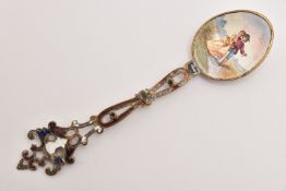 AN ENAMEL GILT TEASPOON, romantic enamel scene with worn enamel open work handle, unmarked metal