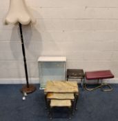 A BRASS AND ONYX NEST OF THREE TABLES, a class display cabinet, smoked plastic table, a rocking