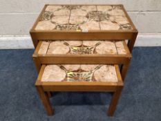 A MID-CENTURY TILE TOP NEST OF THREE TABLES Dimensions:largest table width 66cm x depth 45cm x