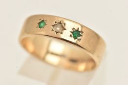 A 9CT YELLOW GOLD GEM SET BAND RING, a flat profile band, approximate band width 6mm, star set