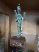 A BRONZE FIGURE OF AN ARCHER, possibly Sardinian, sculpted holding a bow with arrows on his back, on