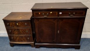 A REPRODUCTION MAHOGANY DOUBLE DOOR CABINET, with two drawers, along with a bow front chest of three