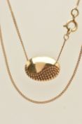 A 9CT YELLOW GOLD PENDANT NECKLACE, an oval form pendant with textured detail, suspended from a fine
