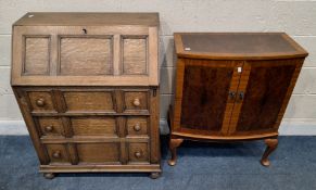 AN EARLY 20TH CENTURY OAK BUREAU, the fall front door enclosing a fitted interior, over three