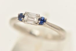 A PLATINUM THREE-STONE RING, an east west set emerald cut diamond, GIA certified diamond,