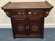 A HARDWOOD ORIENTAL STYLE CABINET, with two drawers over double cupboard doors Dimensions:width 79cm