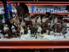 A LARGE GROUP OF CERAMIC DOG ORNAMENTS to include models of bulldogs, beagles, greyhounds, spaniels,