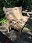 A MODERN WOODEN EFFECT GARDEN BENCH with slatted seat and back Dimensions:123cm wide Condition