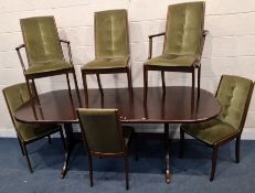 A McINTOSH MID-CENTURY MAHOGANY OVAL DINING TABLE, with one additional leaf, along with a set of six