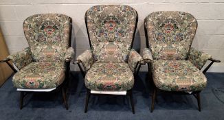 LUCIAN ERCOLANI, A SINGLE AND A PAIR OF ERCOL DARK ELM AND BEECH ARMCHAIRS, with foliate
