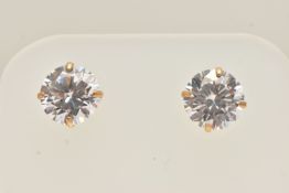 A PAIR OF YELLOW METAL CUBIC ZIRCONIA STUD EARRINGS, each set with a colourless cubic zirconia, post