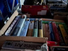 FOUR BOXES OF BOOKS containing approximately ninety titles in hardback and softback format on the