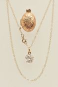 A 9CT YELLOW GOLD LOCKET AND YELLOW METAL PENDANT, a small oval form locket, hallmarked 9ct